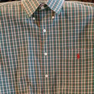 Long sleeved collared button down shirt.